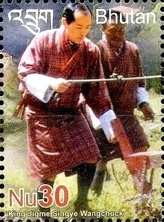 Colnect-3420-715-King-Jigme-Singye-Wangchuk-at-plow.jpg