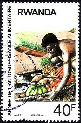 Colnect-2861-375-Boy-carrying-basket-of-fish---produce.jpg