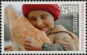 Colnect-513-395-Child-with-bread.jpg