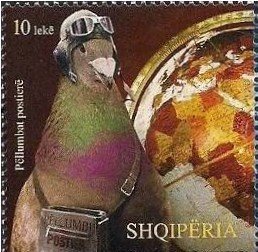 Colnect-1540-604-Globe-and-pigeon-Columba-livia-domestica-with-mail-bag.jpg