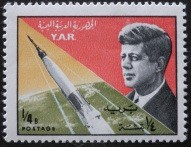 Colnect-1754-697-JFKennedy-and-space-rocket.jpg