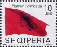 Colnect-1533-616-Albanian-flag-blowing-in-wind.jpg