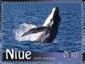 Colnect-4759-144-Humpback-Whale-Megaptera-novaeangliae-A-Calf-breaching.jpg