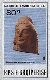 Colnect-1477-411-Terra-cotta-woman-s-head-6th-7th-cent-BC.jpg