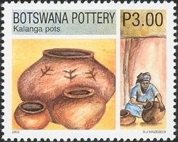 Colnect-1424-464-Kalanga-Finished-Pots-and-a-Woman-Forming-a-Pot.jpg