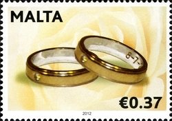 Colnect-1371-565-Two-gold-rings.jpg