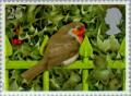 Colnect-123-063-European-Robin-Erithacus-rubecula-on-Railings-and-Holly.jpg