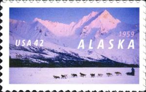 Colnect-887-659-50-Years-State-of-Alaska-Dog-sledding-at-Rainy-Pass.jpg