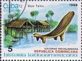 Colnect-1224-490-Typical-houses-and-animal-shaped-seat-Dominica.jpg