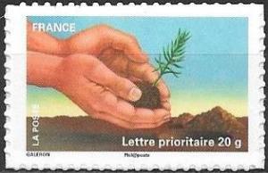 Colnect-4365-392-Hand-with-seedling.jpg