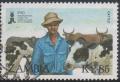 Colnect-4469-013-Farmer-and-cattle.jpg