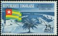 Colnect-5138-105-Lom%C3%A9-Harbor-and-Togolese-flag.jpg