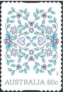 Colnect-1124-573-Pattern-of-hearts-flowers-and-vine-leaves.jpg