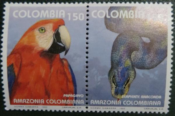 Colnect-2894-189-Red-and-green-Macaw-Ara-chloroptera-Green-Anaconda-Eunec.jpg