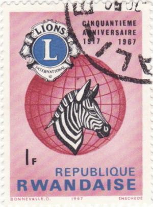 Colnect-1099-774-Lions-Emblem-Globe-and-Plains-Zebra-Equus-quagga.jpg