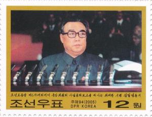 Colnect-3199-618-Kim-Il-Sung-behind-a-row-of-microphones.jpg