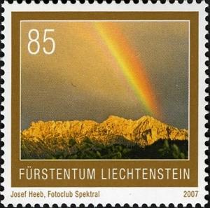 Colnect-1133-905-Rainbow-above-Three-sisters-Massif.jpg