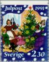 Colnect-164-732-Family-dancing-round-Christmas-tree.jpg