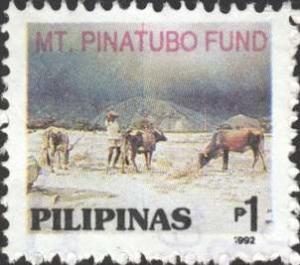 Colnect-2260-593-Mt-Pinatubo-Fund--Cattle-in-ash-covered-field.jpg