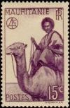 Colnect-803-010-Man-on-Dromedary-Camelus-dromedarius.jpg