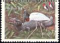 Colnect-1976-341-Red-crested-Cardinal-Jabiru-Caiman.jpg