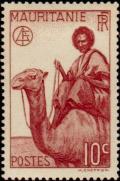 Colnect-803-009-Man-on-Dromedary-Camelus-dromedarius.jpg