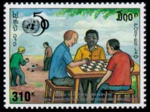 Colnect-4264-832-UN50-Men-seated-at-table-playing-checkers.jpg