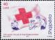 Colnect-3984-372-Red-cross-and-aid-workers-helping-injured-man-feeding-woman.jpg