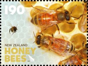 Colnect-2019-737-Honey-Bee-Apis-sp---in-the-Hive.jpg