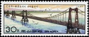 Colnect-2847-779-Suspension-bridge-between-Sinuiju-Ryucho-Island.jpg