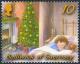 Colnect-3966-275-Sleeping-Boy---Christmas-Tree.jpg