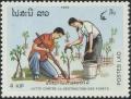 Colnect-2694-761-Family-planting-a-tree.jpg