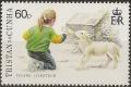 Colnect-4337-525-Girl-feeding-lamb.jpg