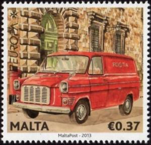 Colnect-5249-051-Ford-Transit-Mark-1-passing-former-GPO-Valletta.jpg