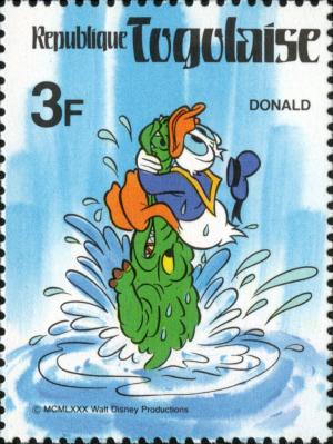 Colnect-7482-625-Donald-Duck-holding-the-snout-of-a-crocodile.jpg