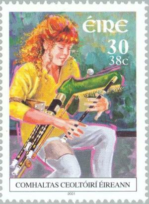 Colnect-129-805-Uilleann-Pipes-Player.jpg