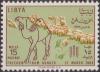 Colnect-1458-216-Camel-and-flock-of-sheep.jpg