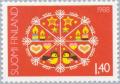 Colnect-159-999-Christmas-Snow-Crystal-with-Christmas-Symbols---phosphor.jpg