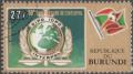 Colnect-1975-623-INTERPOL-Emblem-Burundian-Flag.jpg