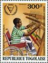 Colnect-7355-478-Disabled-Man-in-Wheelchair-Weaving.jpg