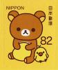 Colnect-5257-326-Rilakkuma-with-Yellow-Cushion.jpg