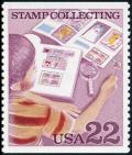 Colnect-4840-172-Boy-Examining-Stamp-Collection.jpg