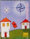 Colnect-1531-520-%E2%80%ADNATO-emblem-Buildings-and-Albanian-flag.jpg