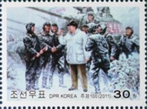 Colnect-2954-994-Kim-Jong-Il-and-tank-drivers.jpg