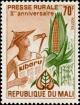 Colnect-2425-656-Farmer-holding-Newspaper-and-Ear-of-Corn.jpg