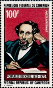 Colnect-2771-009-Dickens-Holding-Quill-Pen.jpg