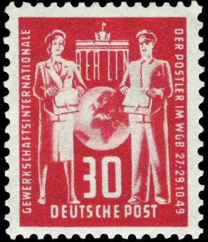 Colnect-483-726-Brandenburg-Gate-Berlin--Globe-between-postwoman-and-postma.jpg