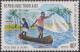 Colnect-1458-632-Fisherman-casting-net-from-canoe.jpg