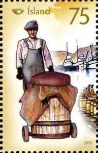 Colnect-3913-938-Man-rolling-herring-barrel.jpg