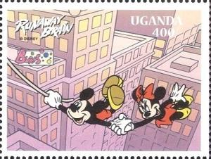 Colnect-6057-323-Mickey-and-Minnie-holding-onto-rope-above-skyscrapers.jpg